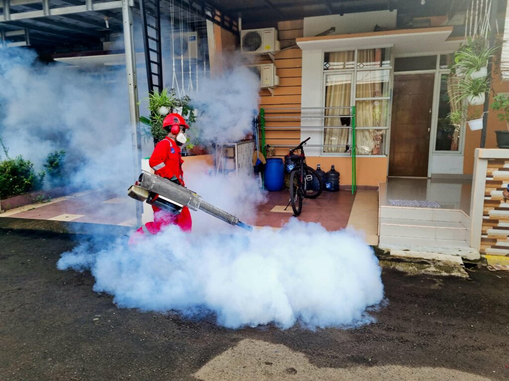 Professional fumigation in front of a house for cheap pest control services Cairns.