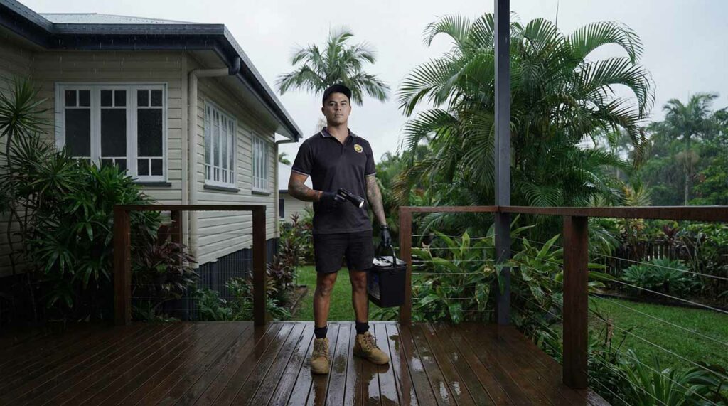 Kurt from Tropical Palms inspecting the exterior of a Cairns home during the wet season for signs of cockroach activity.
